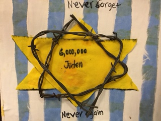 Barbed wire adorns this tile which Shayla Lords made for the Holocaust class. Photo by: Brielle Hammond.